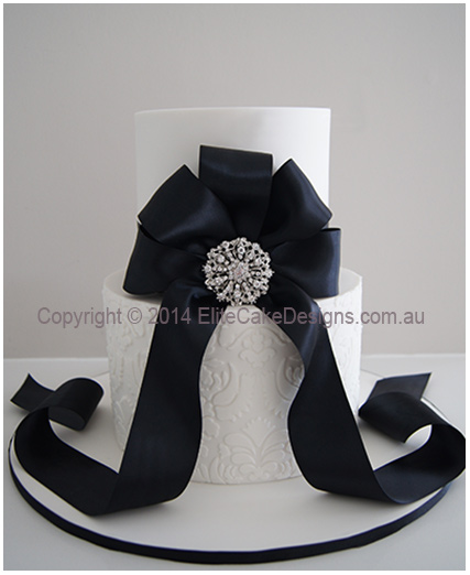 Damask Wedding Cake with Black ribbon and Crystal Broche